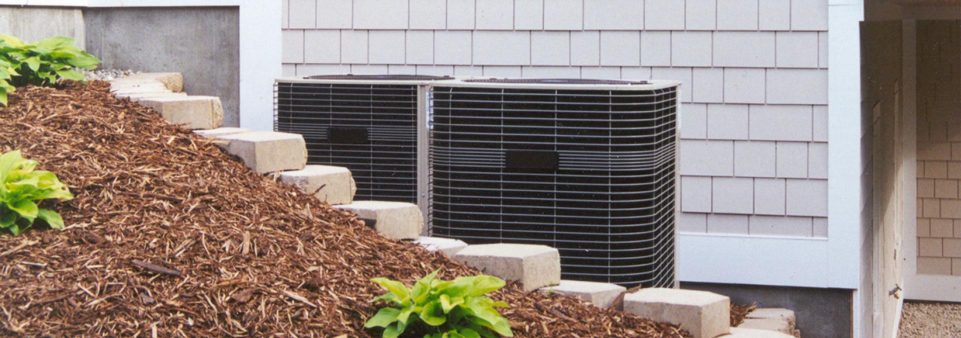 HVAC unit next to a residence