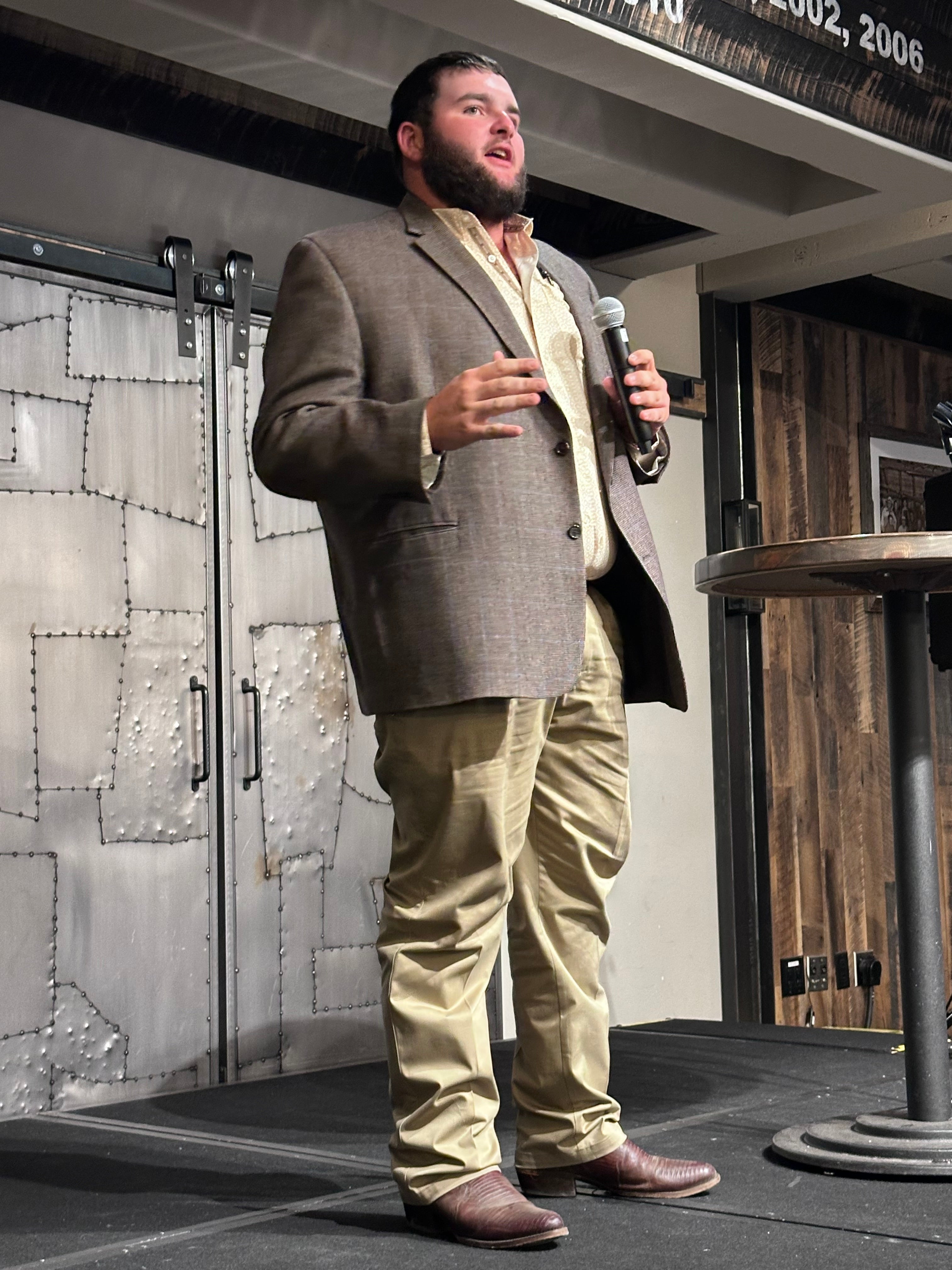 student speaking on stage